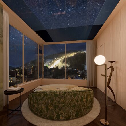Sternenzimmer mit Glasdach im Hotel nōa Schladming mit Panoramafenstern, Rundbett und Aussicht auf die berühmte Skipiste